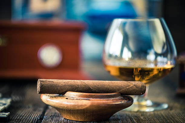 istock cuban cigar and glass of rum or cognac 592654592