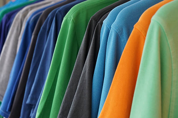 bunte poloshirts - polo shirt multi colored clothing variation stock-fotos und bilder
