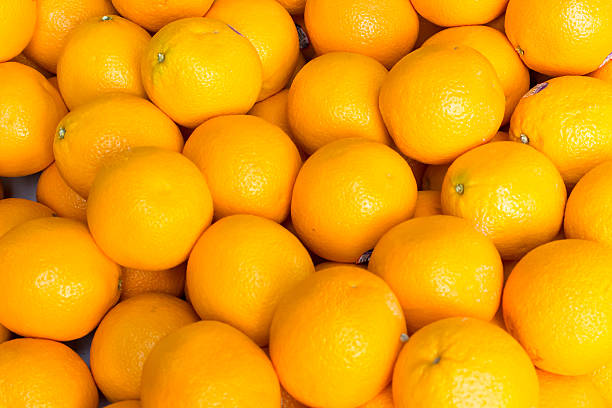 istock Oranges sold on an outside asian market 592656604