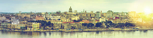 Wide panorama over Havana in Cuba with sun flare and toned effect