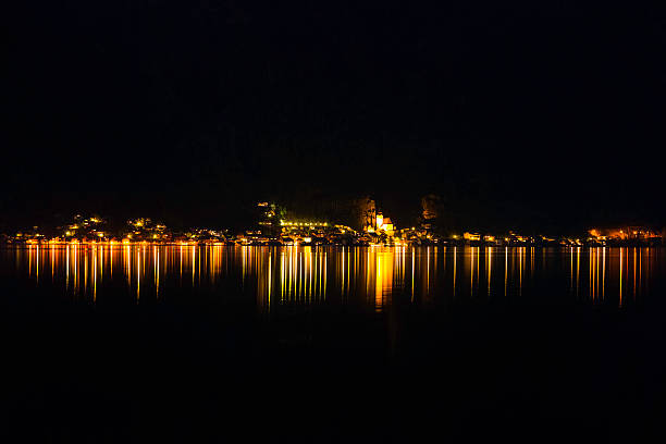 istock mountain lake with city lights in the evening 592657286