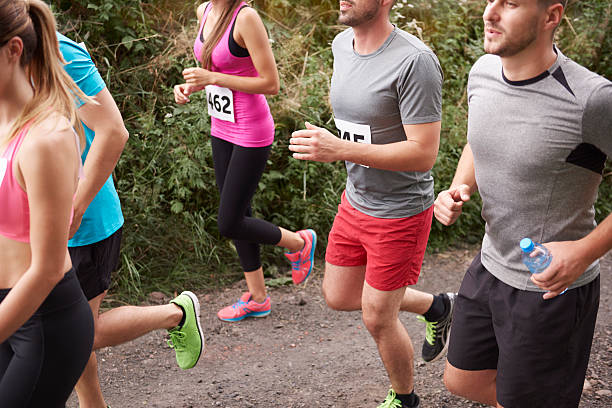 istock Group of young people on the jogging marathon 592658060