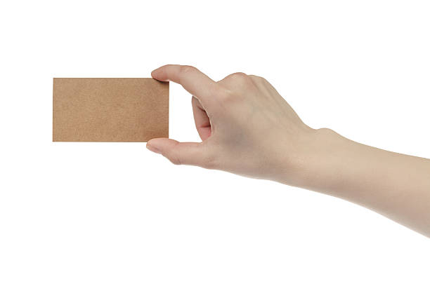istock young female right hand hold blank brown paper card 592658124