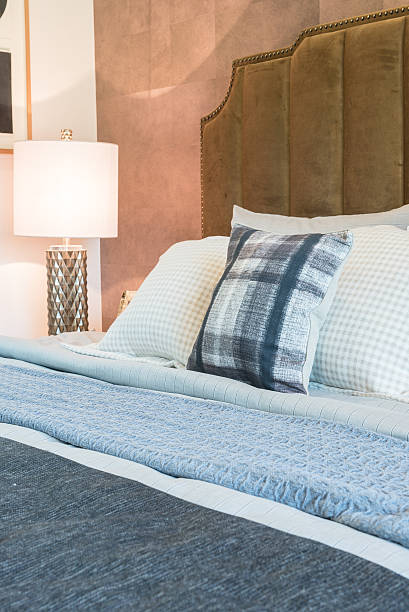istock luxury bedroom with set of pillows on bed 592659392