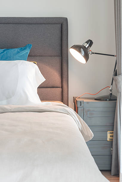 istock modern black lamp on table side in modern bedroom 592659766