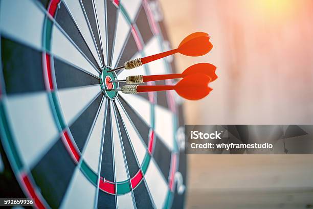 Red Dart Arrow Hitting In The Target Center Stock Photo - Download Image Now - Dartboard, Bull's-Eye, Accuracy