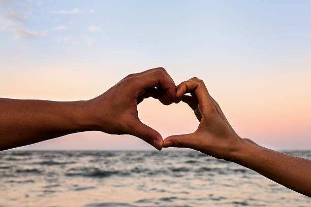 istock Couple hand put on the heart shape 592660002
