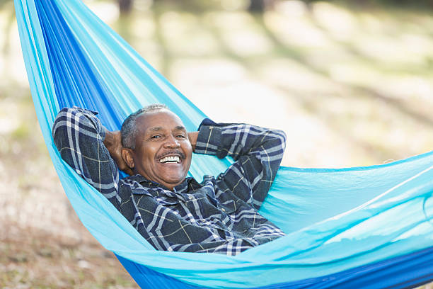 istock Senior African American man lying in hammock 592660752