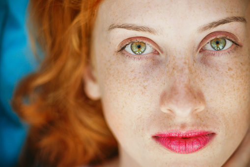 Portrait of a young beautiful redhead girl