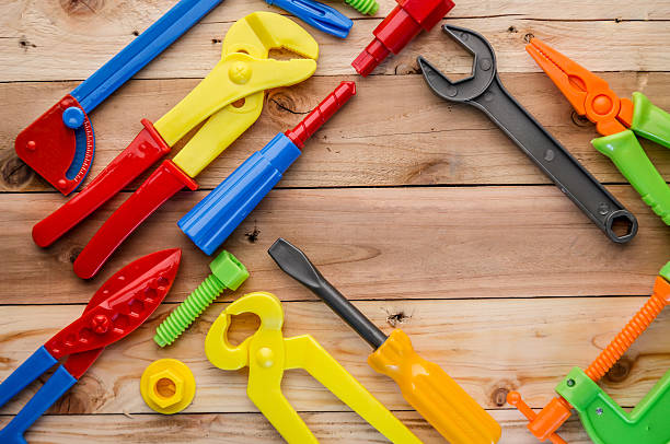 istock tools and instruments toys on wood texture 592661000