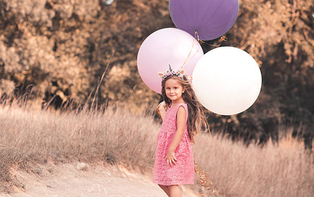 stylish kid girl with balloons - personal accessory balloon beauty birthday imagens e fotografias de stock