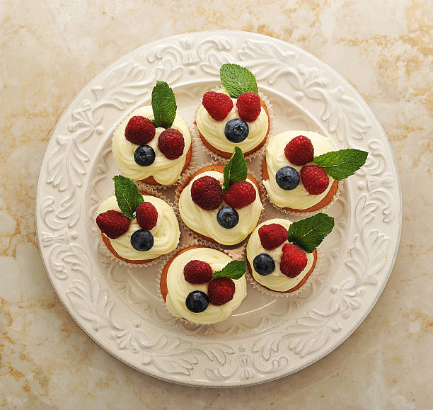 istock cakes with raspberries and blueberries on a plate 592661948