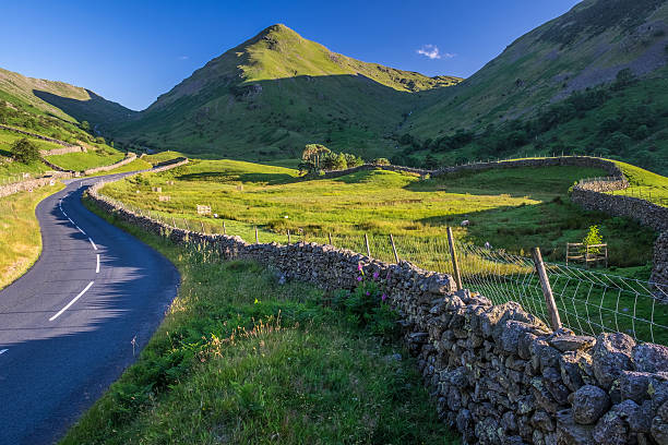 istock Countryside road in the mountain. 592662384