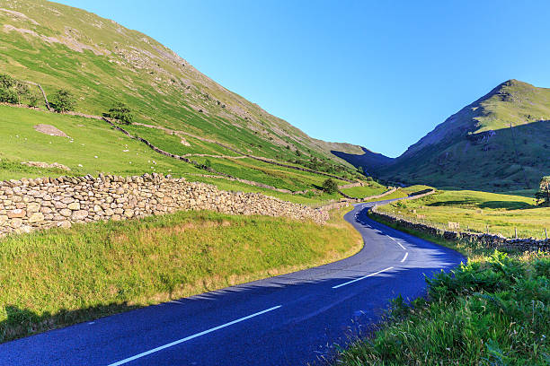 istock Countryside road in the mountain. 592662400