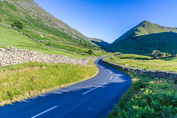 istock Countryside road in the mountain. 592662408