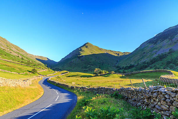 istock Countryside road in the mountain. 592662454