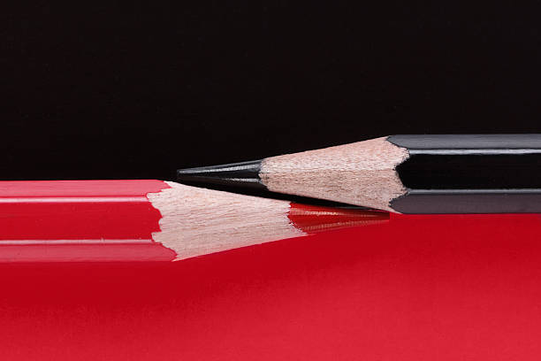 istock Competition, teamwork, partnership concept, black and red pencil on paper 592663192