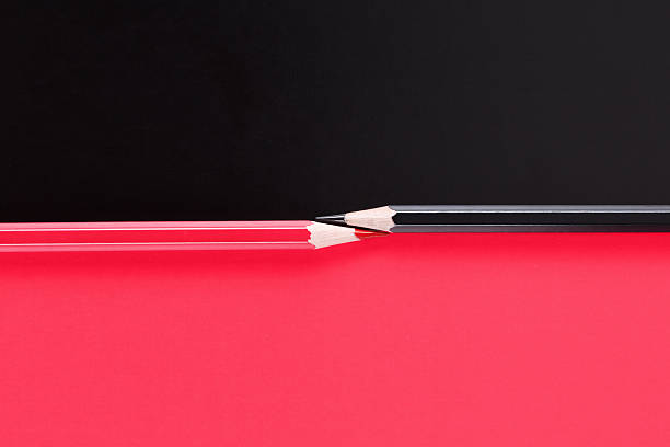 istock Competition, teamwork, partnership concept, black and red pencil on paper 592663372