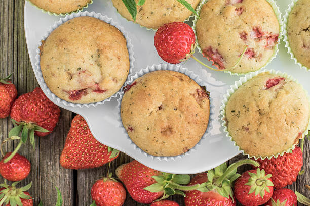 istock Top View on Strawberry and Mint Muffins on White Plate 592664170