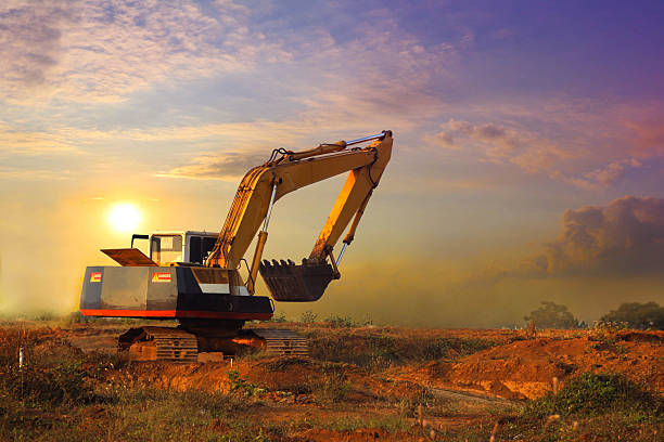 istock Excavator working and moving earth in construction afternoon 592667342