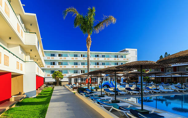 istock courtyard of a modern hotel with pool and sunbeds 592671018