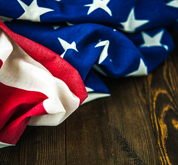 istock American flag on wood table for US holidays 592672212
