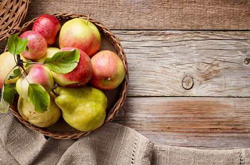 various fresh fruits on wooden table, top view