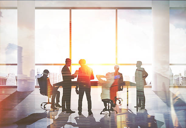 istock Group of people in suits at meeting 592675918