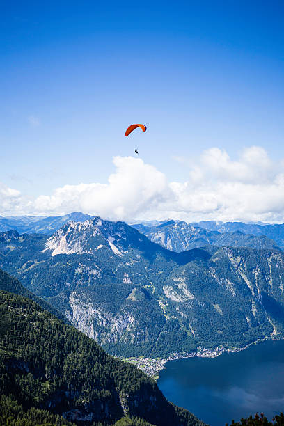istock paragliding over the Alps mountains 592675940