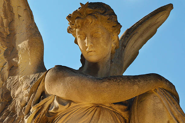 istock golden angel in the sunlight (antique statue) 592677182