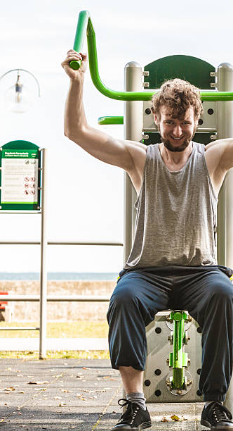 istock Active man exercising at outdoor gym. 592677206