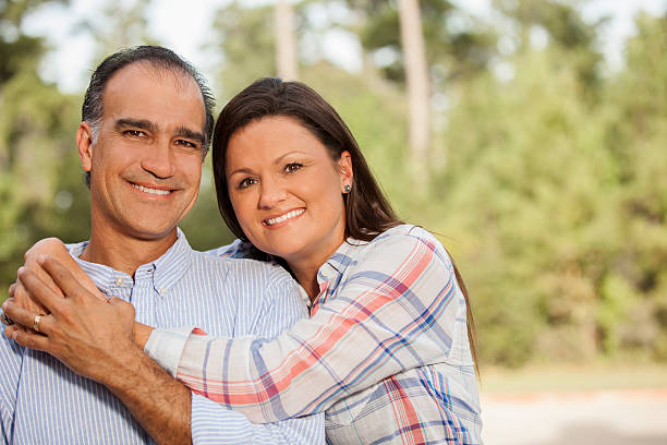 istock Mature, mixed-race couple outdoors in summer. 592677324