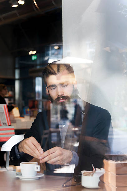 istock hipster businessman on break for a coffee 592677650