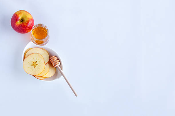 istock Apples, pomegranate and honey for Rosh Hashanah 592677856