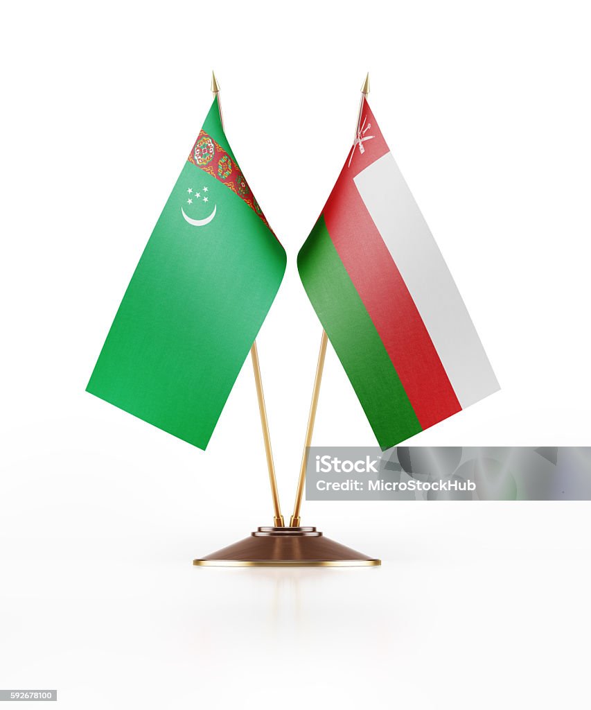 Miniature Flag of Turkmenistan and Oman Miniature Flag of Turkmenistan and Oman. The flags have nicely detailed fabric texture. Isolated on white background. Clipping path is included. Omani Flag Stock Photo