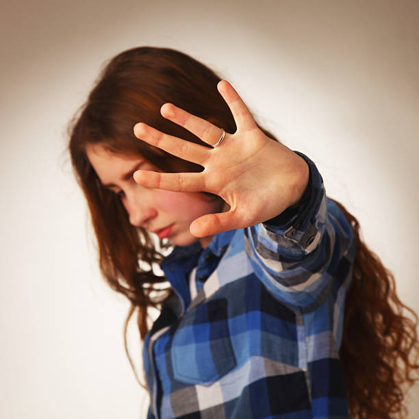 istock Girl showing stop hand sign gesture (Body language, gestures, ps 592678518