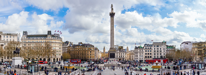 London, United Kingdom - April 7, 2016: Busy afternoon at Trafalgar square. Locals and tourists visiting the most famous square in UK and the National gallery