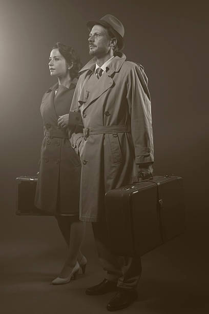 istock Film noir: elegant couple leaving in the dark 592679410