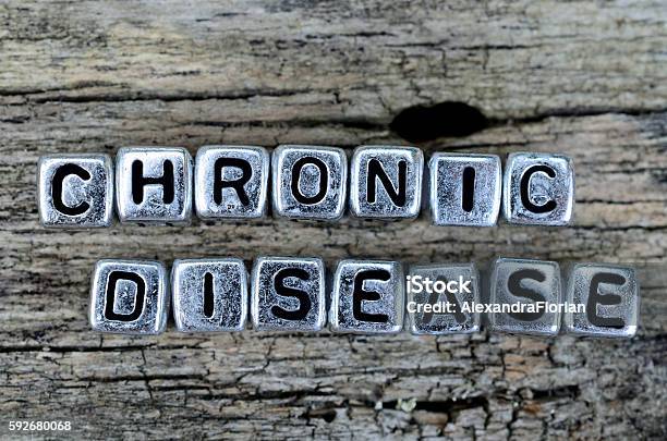 Cube Word Chronic Disease On Table Stock Photo - Download Image Now - Chronic Illness, Healthcare And Medicine, Alphabet