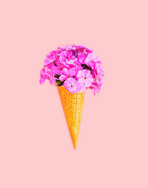 istock Ice cream cone with flowers over colorful pink background 592680094