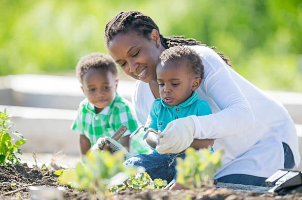 istock Twins Playing in the Garden 592680666
