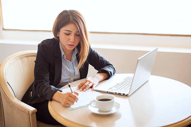 istock Female attorney reviewing some contracts 592682620