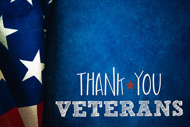 istock Chalkboard and flag with thank you message for US Veterans 592684210