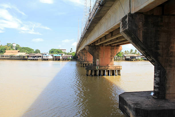 istock Vintage image of Cement bridge over the river. 592688292