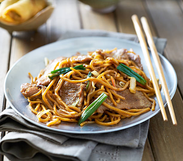 istock chinese food - beef lo mein on a plate 592688522