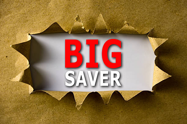 istock Torn brown paper with BIG SAVER words 592688764