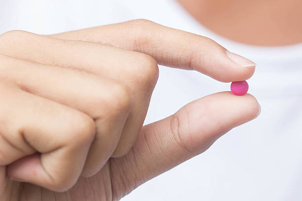 istock Medicine pills in hand , selective focus 592688896