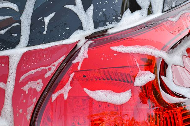 istock Car wash with flowing water and foam 593294056