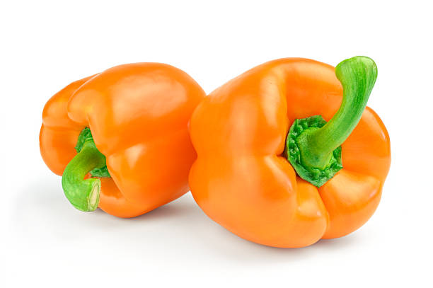 istock Two sweet orange pepper isolated on white background 593296588