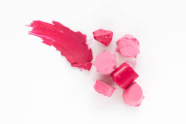 istock Cut pink lipstick with smear of one, flat lay 593297016